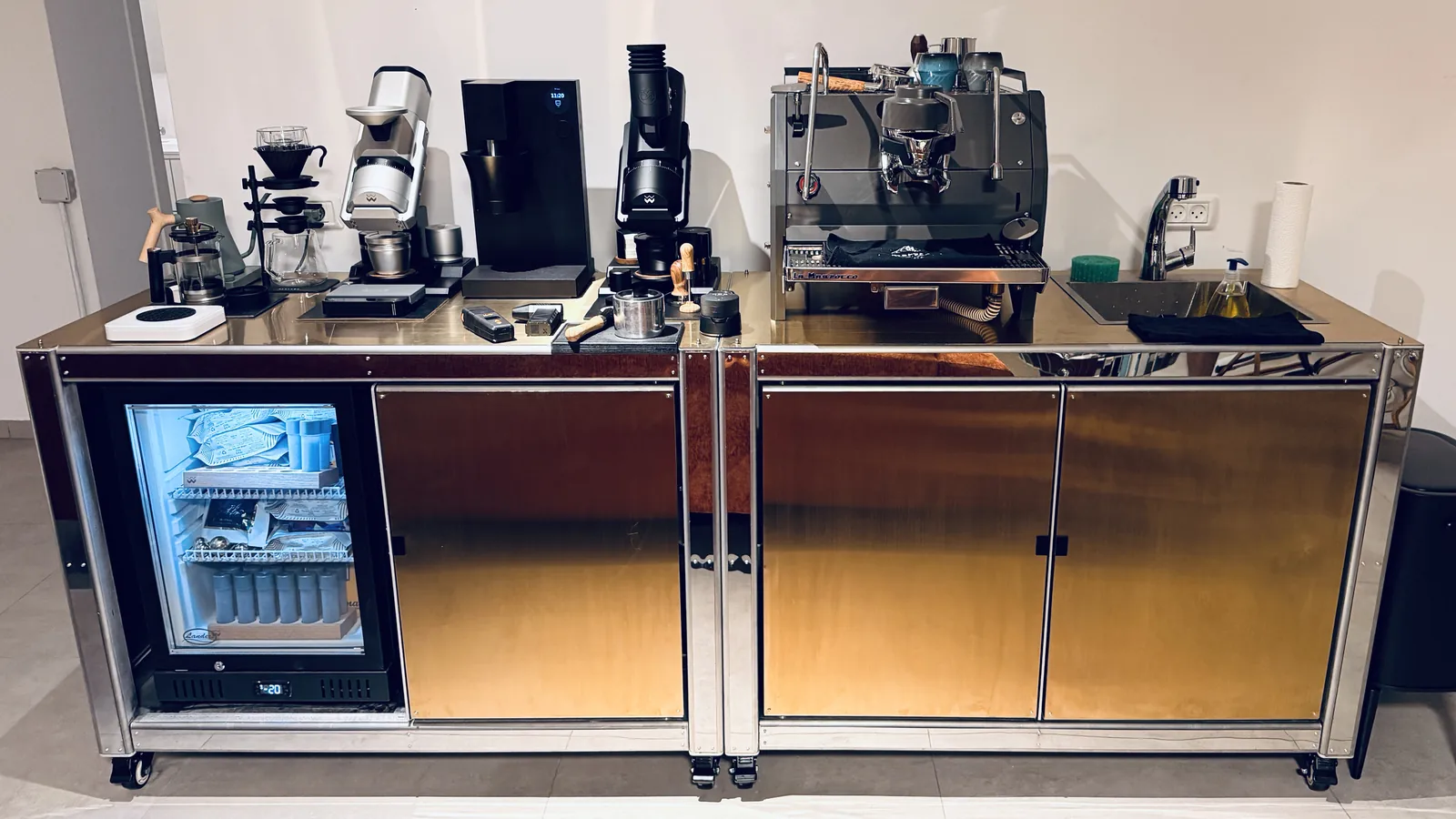 Wide frontal view of Cube Coffee with the refrigerated bay open at one end.