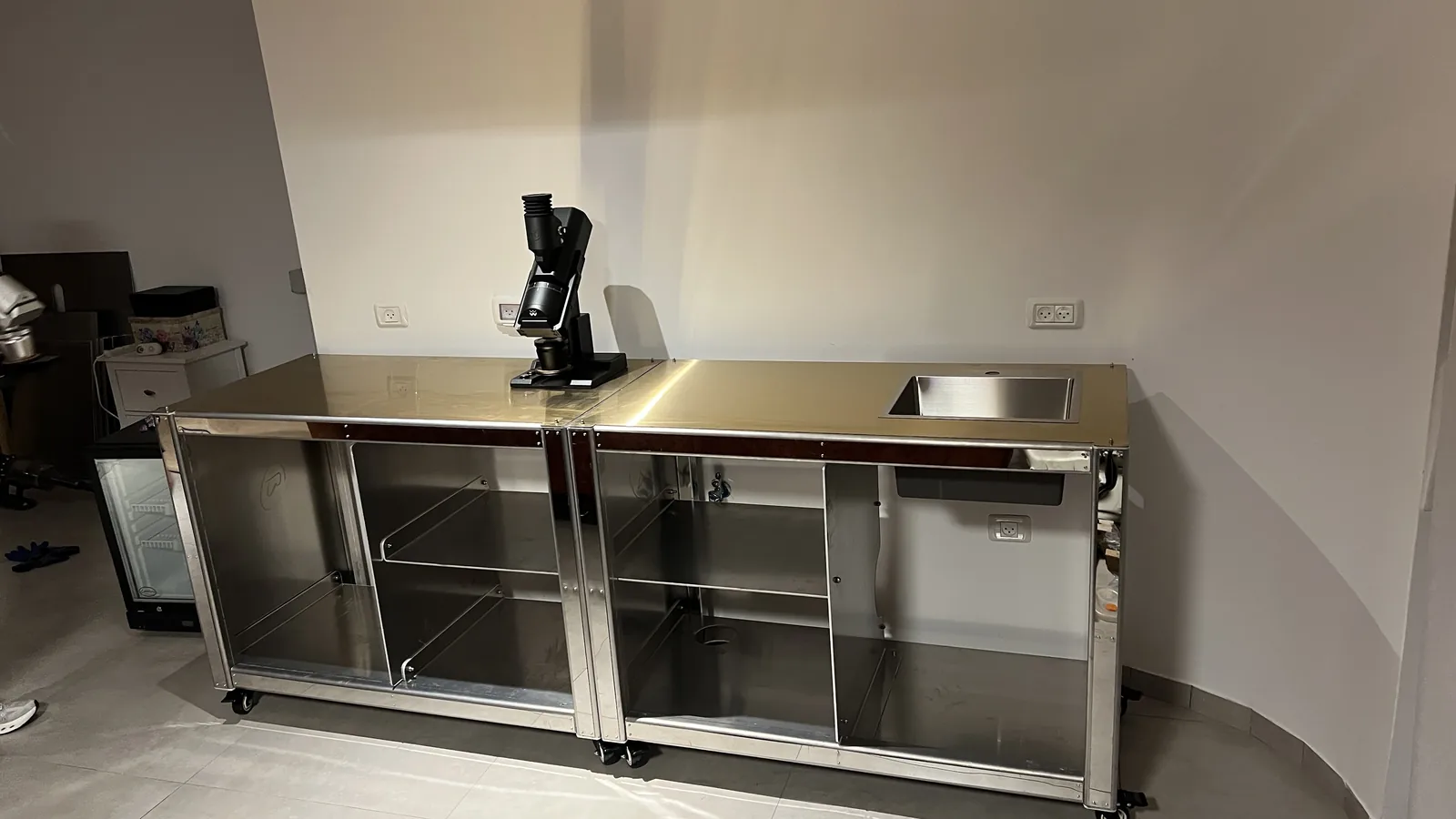 Close view of the empty steel carcass of Cube Coffee, shelves bare.