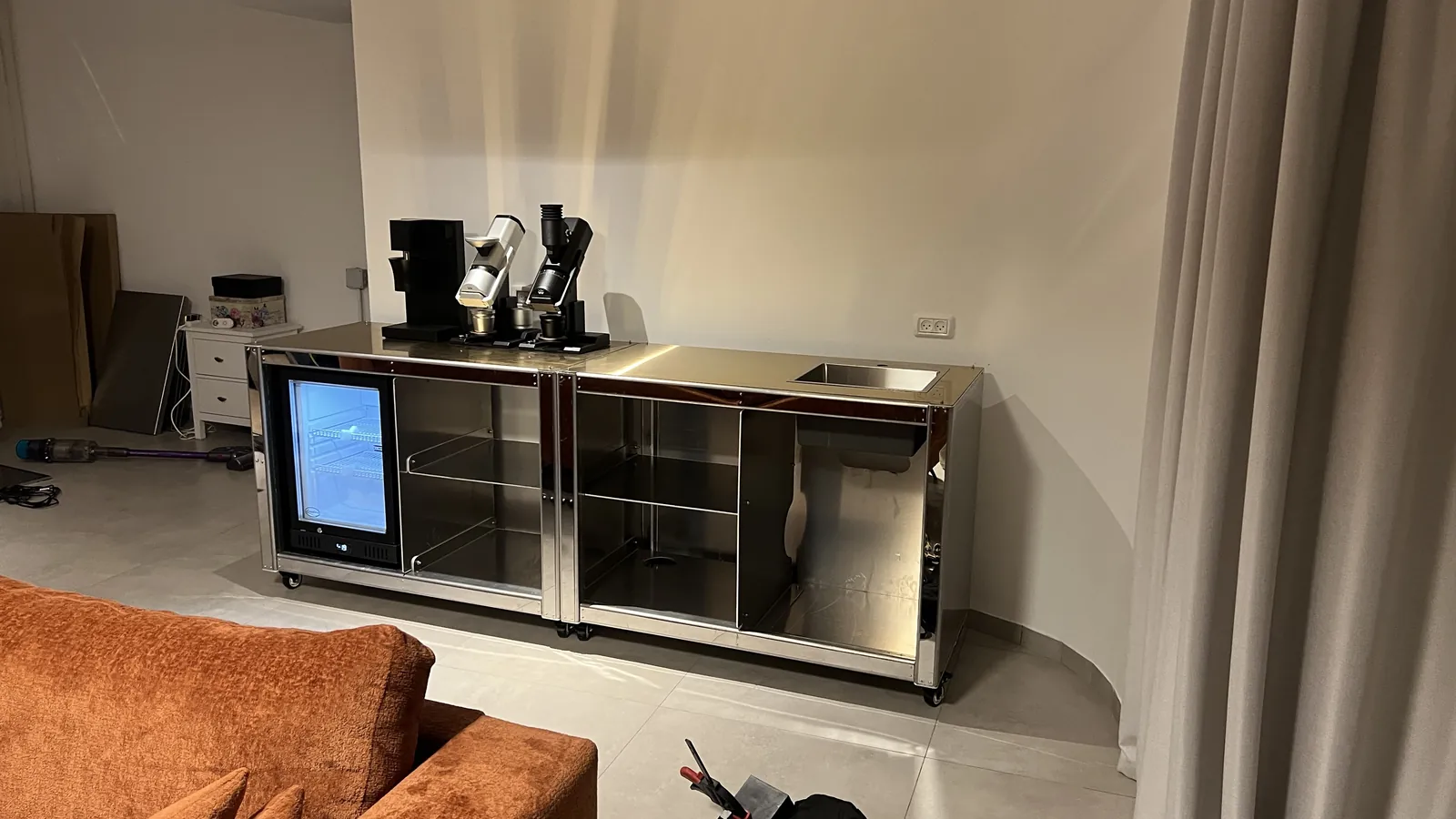Cube Coffee frame carrying its lit display, still unclad.
