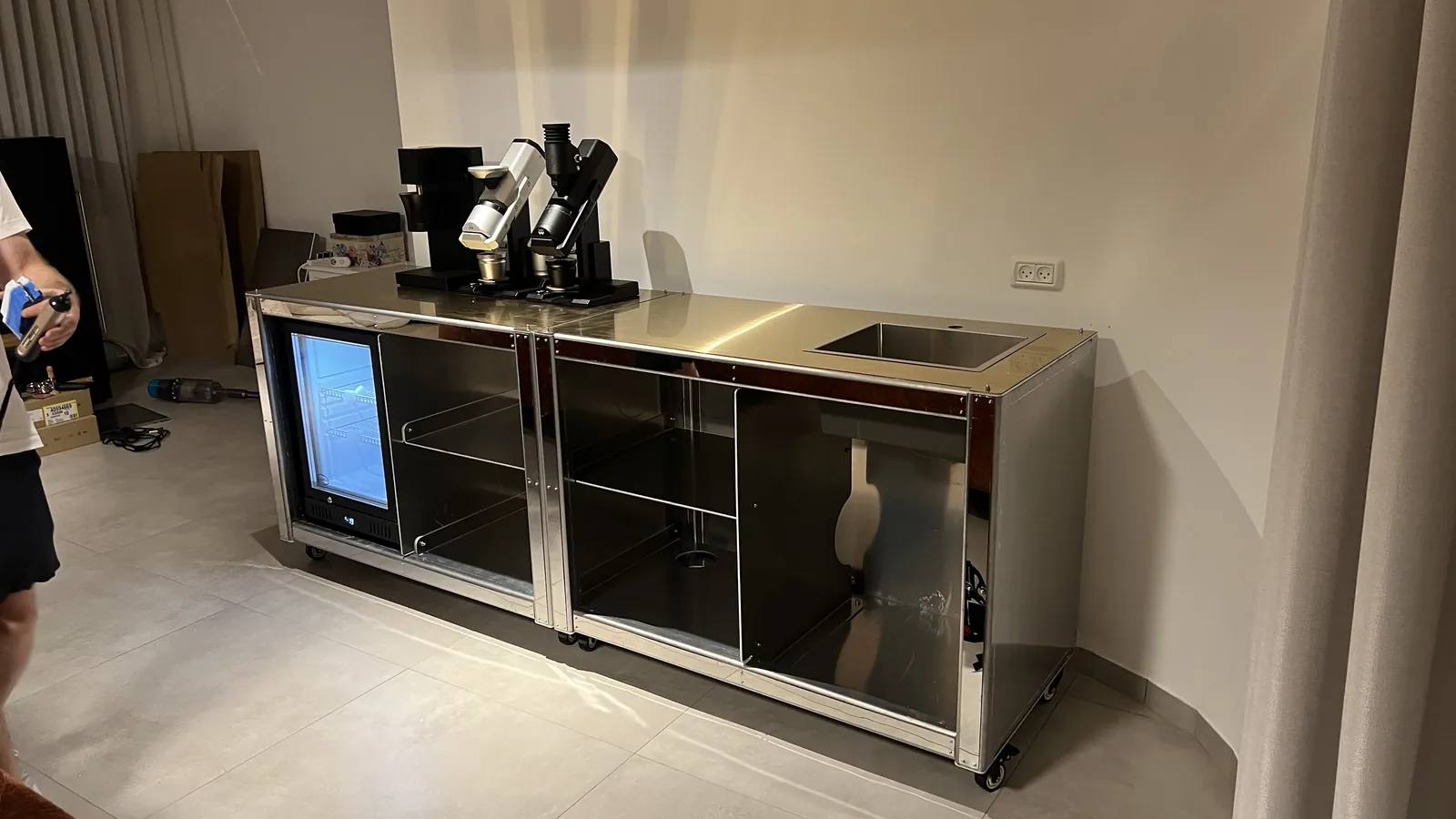 Equipment being loaded onto the unclad Cube Coffee frame.