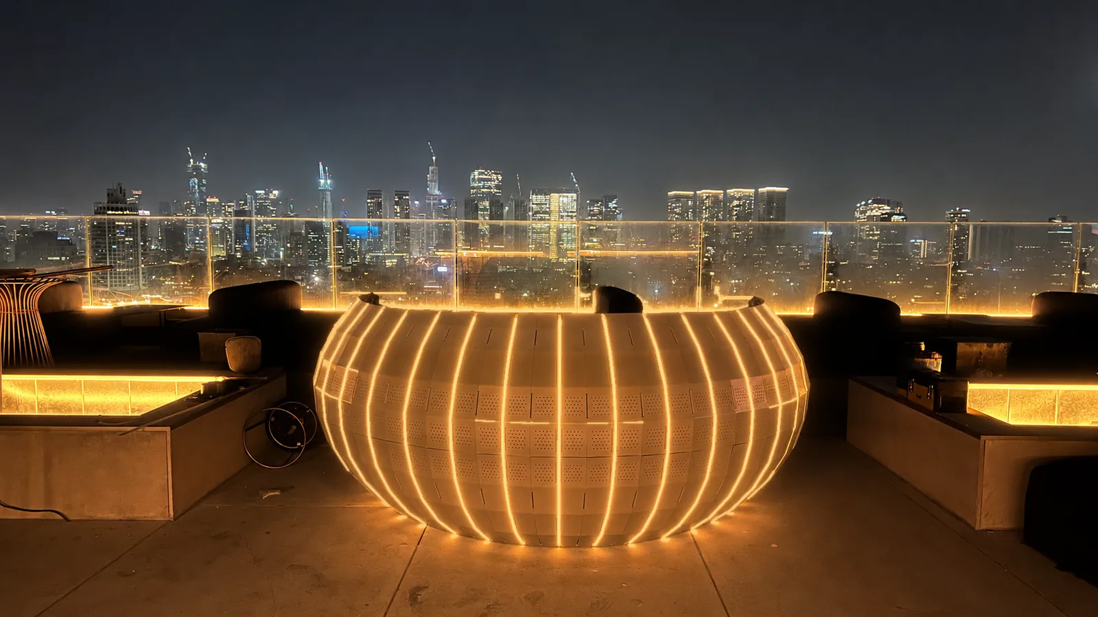 Tri Hex 36 at night — warm single-tone LED matching the terrace light.