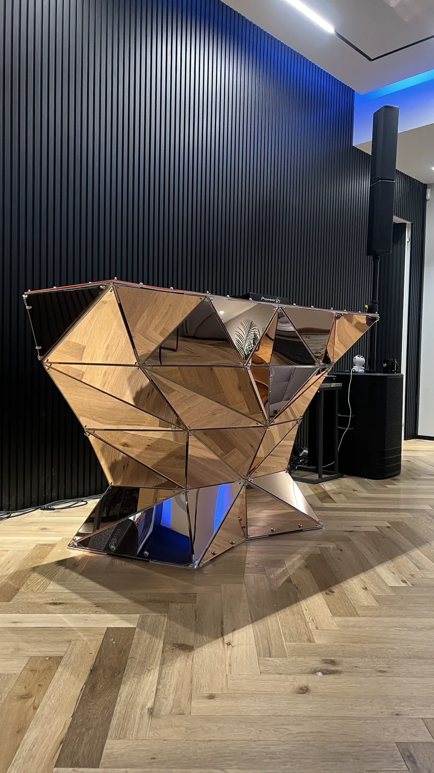 Tri Rose assembled in a studio room with mirrored petal cladding.
